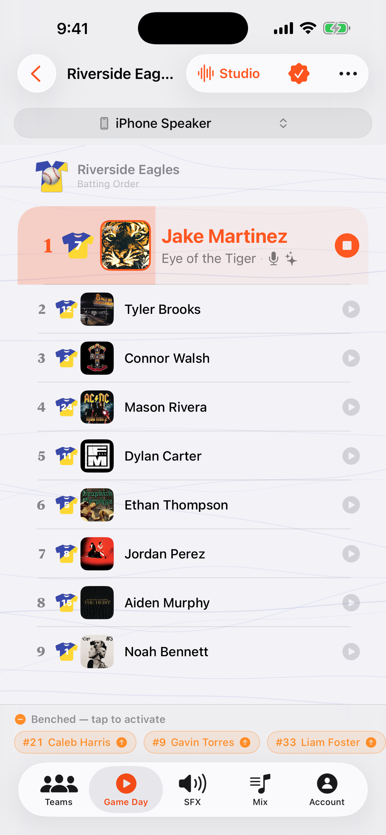 The Game Day soundboard in GameDay DJ, showing player tiles with jersey numbers and walk-up song info, with the on-deck batter highlighted.